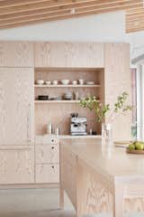 Vancouver-based architectural millwork company, Intempo Interiors, added a milled wire- brushed veneer to create cabinetry with a tactile texture that is "like the weathered wood you find on the shores of British Columbia,