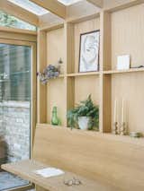 "On our first site visit, the client showed us a large Welsh dresser which was used for display. While we couldn’t find room for it in the lower ground floor, we did manage to reinterpret it’s functionality as a wall of oak shelving used for storage and display.  Photo 4 of 10 in An Old London Victorian Gets a Greenhouse-Inspired Dining Room