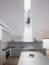 Kitchen of Split House by GSBN Studio