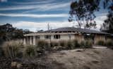 Exterior, Curved RoofLine, House Building Type, Stucco Siding Material, and Metal Roof Material  Photo 2 of 5 in yackandandah strawbale house by soft loud house architects