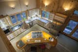 The hand built maple kitchen with walnut and mahogany island. The floor is poured concrete with radiant heating beneath.