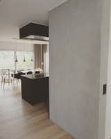 Concrete, wood, matte black kitchen