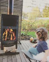 Daughter, Clara in front of the cozy fireplace