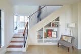 A custom fabricated steel guardrail with an ipe cap by Brian Chilton Design, continues the angular lines found throughout the small house