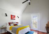 A vaulted ceiling in the bedroom help to make the space feel large and airy