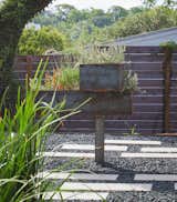 Outdoor, Raised Planters, Planters Patio, Porch, Deck, Front Yard, Metal Patio, Porch, Deck, Pavers Patio, Porch, Deck, Horizontal Fences, Wall, Trees, and Wood Fences, Wall Custom Steel Planter, fabricated by Davey McEathron Architecture  Photo 8 of 15 in Chelsea ADU by Davey McEathron Architecture