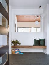 Entry / Foyer - The entry sets up a choice between the public and private wings of the house. A large window increases the porosity of this transitional space, allowing one to see through to the covered porch and backyard beyond. 