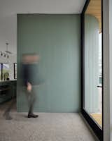 Hallway, Concrete Floor, and Terrazzo Floor painted comb wood siding wraps from the exterior to the interior  Photo 6 of 20 in East 12th Residence by Davey McEathron Architecture