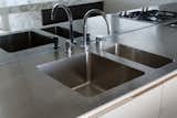 Custom-made stainless steel benchtop and integrated sink.