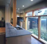 The Master Bathroom addition opens to a private garden court. The room features timeless materials such as Fireslate countertops and Douglas Fir casework.