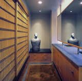 The Master Bath incorporates a changing area with ample storage and a series of antique Japanese sliding screens.