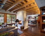 The Great Room sits below a lattice of Douglas Fir beams.  Mahogany floors and casework evoke the traditional materials of Pacific Rim architecture.   Photo 4 of 5 in Lakeside House by Telford+Brown Studio Architecture