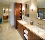 The Master Bath features luxurious materials of Mahogany wood and natural stone.