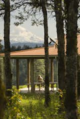 A generous porch offers views over the Columbia Gorge towards the mountain range beyond.