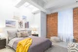 Guest bedroom with beach sunset tones  Photo 5 of 6 in Chelsea Loft by Anne Ruthmann Photography