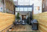Rear deck with open atrium seamlessly extends the indoor space into the outdoor space