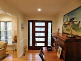 New 5 lite front door illuminates the foyer with natural light.