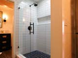 New tile shower with frameless glass door in Jack&Jill bath.
