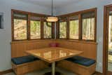 To entertaining the family on those "regular" days. Custom fir booth bench seat and tabletop with stainless steel base, nestled under matching triple Siteline units from JELD-WEN.