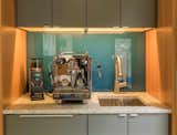 We added a coffee station with bar sink and matching fir cabinetry, glass backsplash, and granite counters.