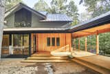 Art gallery addition with relocated front entry and new covered wraparound porch.