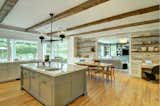 Oversized chef's kitchen with exposed beams