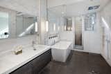 Master bathroom with access to a private outdoor shower. 
