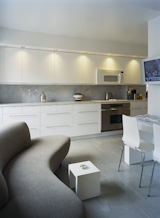 Hariri created spots in every area of her home for quiet, intimate reflection. Even the kitchen has a sofa in the corner, a space where Hariri enjoys her coffee along with the morning news.