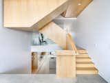 The sculptural oak staircase is the centerpiece of the home. 