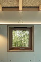 The bamboo blends with the natural grain of the wood frames