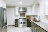Kitchen has stainless steel Jenn Air appliances