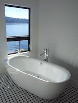 This freestanding tub allows the homeowners to site and enjoy the view during a soak.