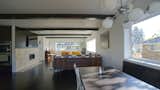 The open living room is both visually and functionally inviting by offering direct connections to the entry, stair, and kitchen beyond.