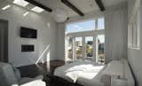 The master bedroom embraces the sophistication that comes with simplicity. The wide windows and glass doors let light stream into the room and create a connection to the rest of the beautiful Kirkland neighborhood and the view beyond.
