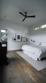 The master bedroom is a clean but cozy space filled with plenty of light from the clerestory windows.