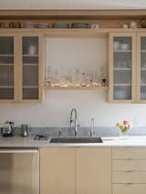 Kitchen, Light Hardwood Floor, Wood Cabinet, Marble Counter, Marble Backsplashe, and Undermount Sink Kitchen  Photos from Lake Union Floating Home