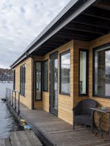Exterior, Small Home Building Type, House Building Type, Wood Siding Material, and Flat RoofLine Cedar siding and wrap around ipe deck with sitting areas  Photo 18 of 20 in Lake Union Floating Home by Atelier Drome