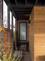 Exterior, Wood Siding Material, Boathouse Building Type, Small Home Building Type, House Building Type, and Flat RoofLine Exterior with cedar slat screen wall and additional storage  Photo 20 of 20 in Lake Union Floating Home by Atelier Drome