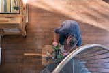 The two story working studio also acts as a work space filled with tools necessary for artists and french doors that open up to a deck to let in the sunshine and for good airflow while working.