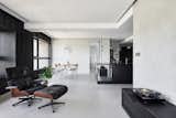 Living Room, Chair, Concrete Floor, and Pendant Lighting  Photo 1 of 25 in Blackened Wood Apartment by CTT Architects