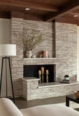 Stone-clad fireplace is the feature of the room.