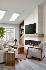 Corner fireplace is a focal point of the living room.