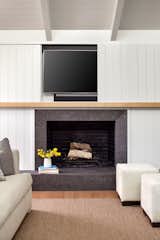 TV can be easily hidden out of site behind the wall panel.