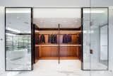 A walk in closet for your suits because you need six suits.