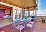 French Doors Open to Large Wrap Around Deck