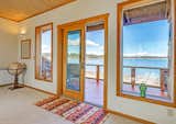 French Doors to 2nd Level Deck Overlooking Fisherman Bay  Photo 14 of 18 in Idyllic Lopez Island Bayfront Home by Karlena Pickering