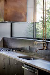 Custom copper vent hood and kitchen faucet