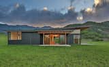 Exterior, House Building Type, Metal Roof Material, Flat RoofLine, and Shed RoofLine North Lanai with Ko'olau Range beyond  Photo 1 of 12 in Hawaii Camp Ahiki Residence by Studio Zerbey Architecture + Interiors