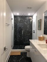 Bath Room, Porcelain Tile Floor, Full Shower, Enclosed Shower, Wall Lighting, Stone Counter, Undermount Sink, Recessed Lighting, One Piece Toilet, Stone Tile Wall, and Marble Counter 2nd bath.  Photo 6 of 14 in Fleetwood Modern by Jeff L Livingston