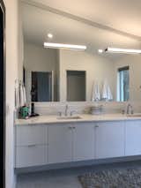 Bath Room, Ceiling Lighting, Undermount Sink, Wall Lighting, Full Shower, Freestanding Tub, Marble Counter, Recessed Lighting, Porcelain Tile Wall, Marble Floor, One Piece Toilet, and Enclosed Shower Master Vanity.  Photo 8 of 14 in Fleetwood Modern by Jeff L Livingston